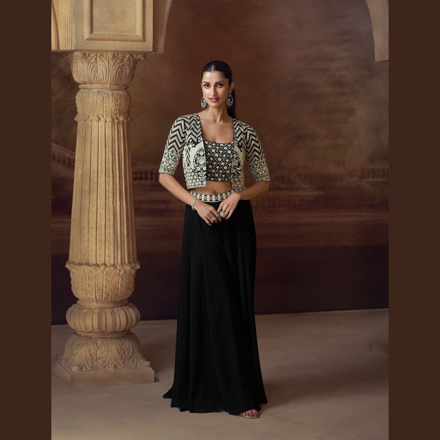 Ziva Noir palazzo with intricately embroidered crop top and geometric mirror-work jacket