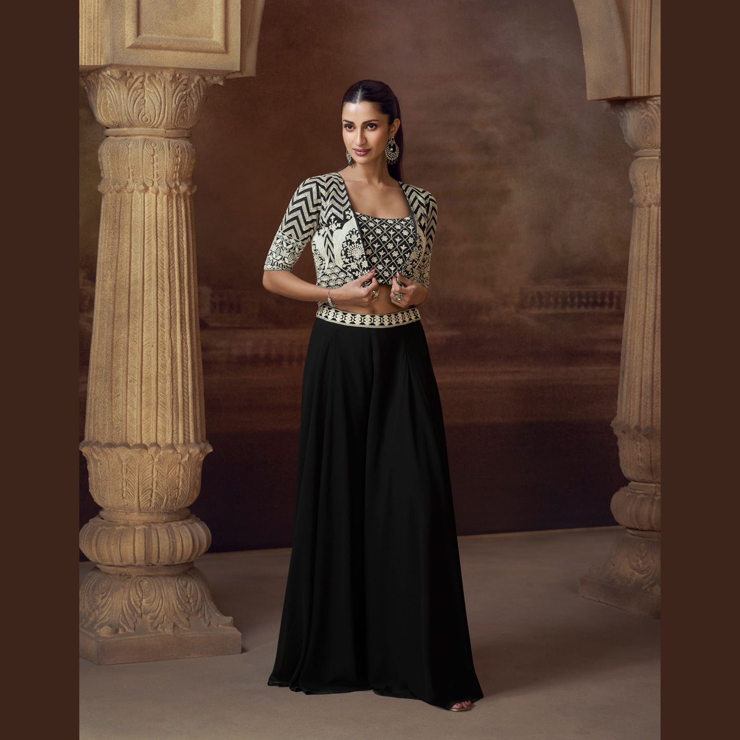 Ziva Noir palazzo with intricately embroidered crop top and geometric mirror-work jacket