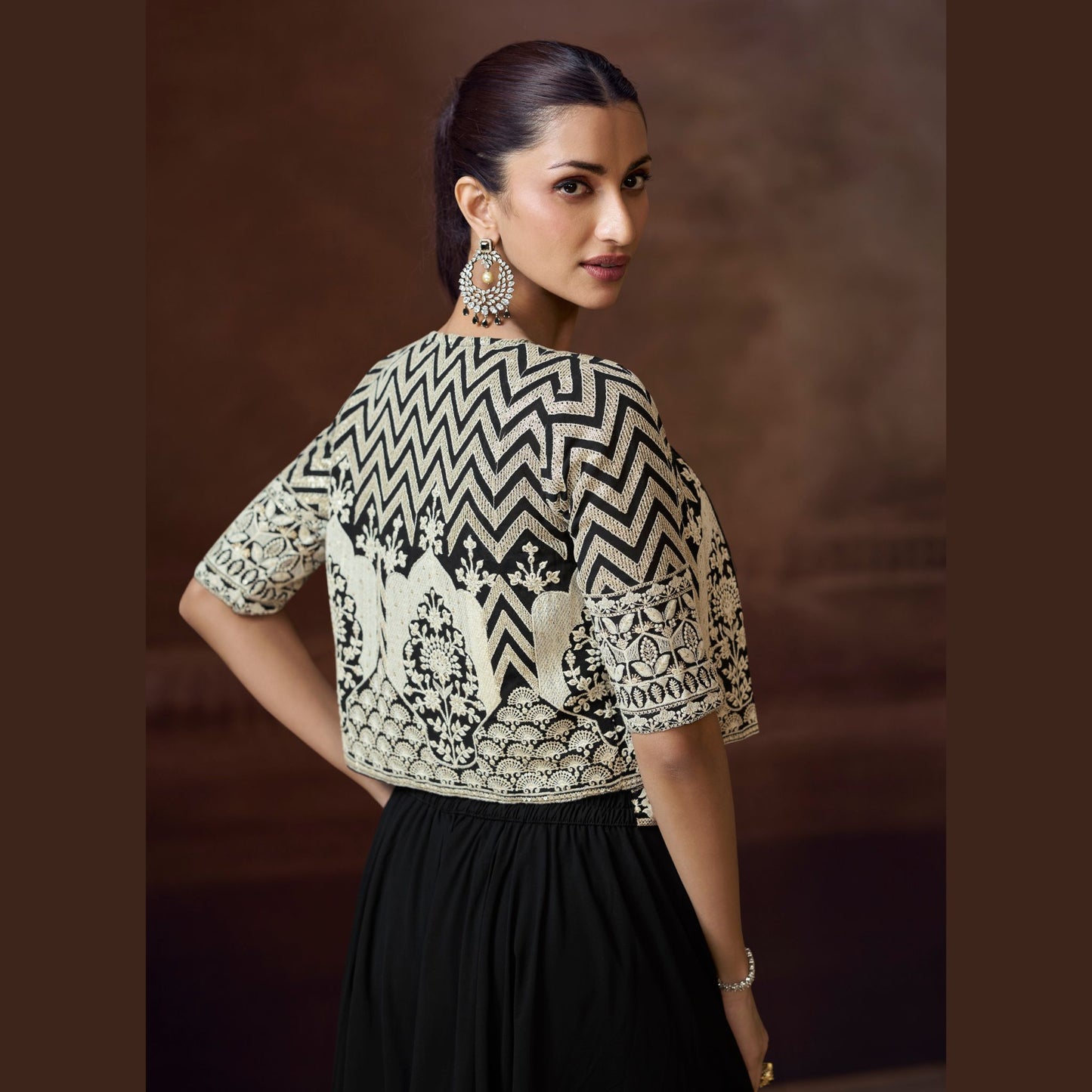 Ziva Noir palazzo with intricately embroidered crop top and geometric mirror-work jacket